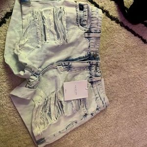 Light blue ripped jean shorts